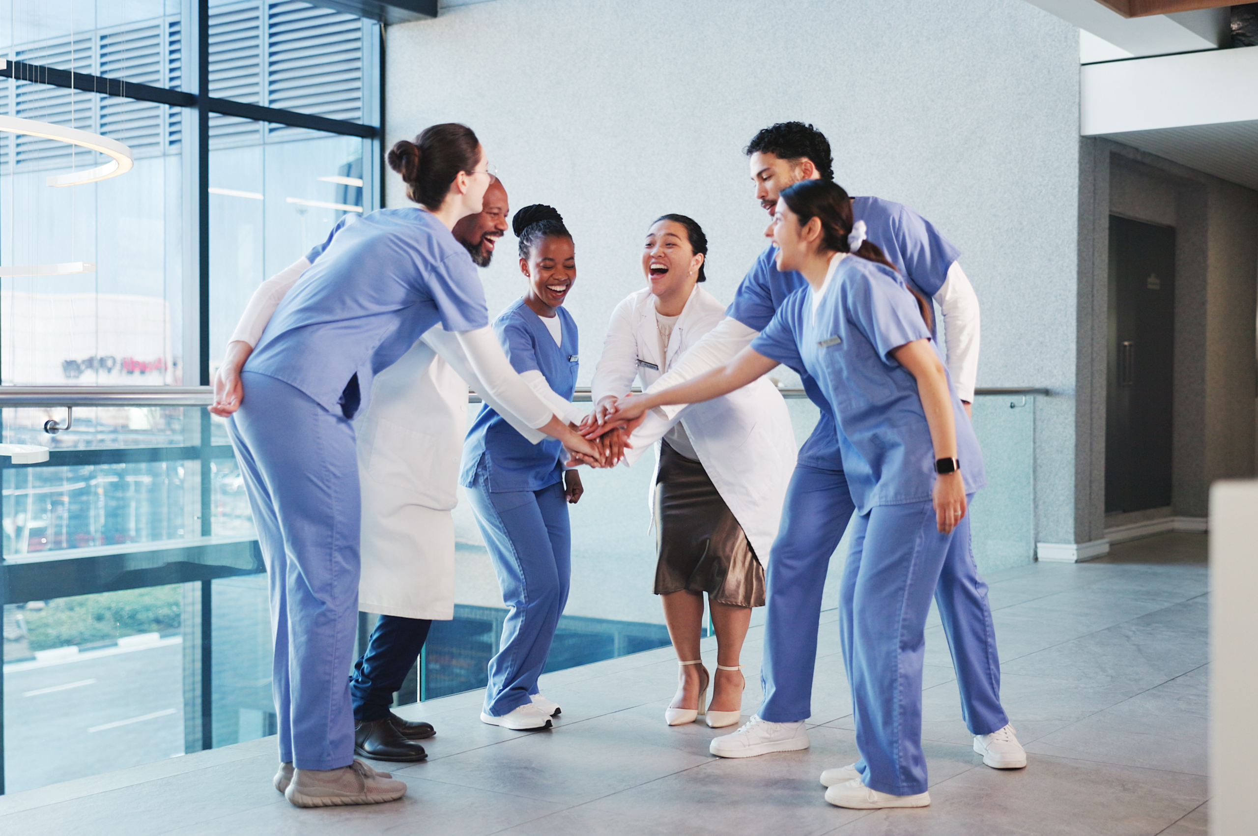 This photograph shows a happy group of healthcare providers. It’s a stock image so the individuals should not be identified. It’s being used to give the impression that the topic of this post is one to celebrate. The text alternative is “Big Win for Direct Primary Care: HSA Eligibility is Now in Effect” as this best describes the topic of the blog post.